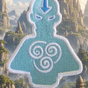 May include: An embroidered patch featuring a light blue silhouette of a figure with a white border. The design includes a dark blue arrow on the forehead, blue eyes, and three white spiral symbols arranged in a triangle on the chest area.