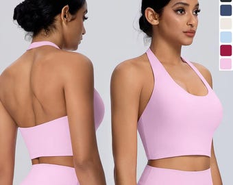 May include: A light pink athletic crop top with a halter neckline and a matching pair of high-waisted leggings. The set is shown from both the front and back views, with a color palette sidebar displaying seven available color options.