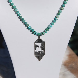 sterling silver necklace with hand cut sterling silver pendant on beaded turquoise