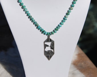 sterling silver necklace with hand cut sterling silver pendant on beaded turquoise