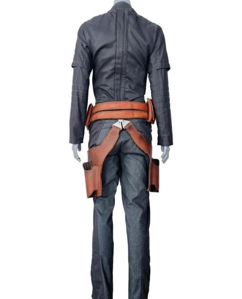 May include: A dark gray long-sleeved shirt and matching trousers paired with a tan leather utility belt. The belt features a wide waistband and two holster-like pouches hanging down the sides, secured with a silver-toned metal buckle at the front.