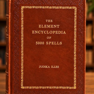 May include: A brown hardcover book titled The Element Encyclopedia of 5000 Spells by Judika Illes. The front cover features a gold embossed border with intricate patterns and gold lettering centered on the front of the textured brown surface.