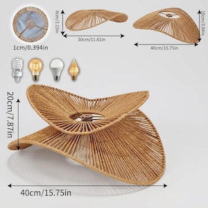 May include: A tan woven rope lampshade with a curved, organic shape. Dimensions shown include a 15.75 inch width, 7.87 inch height, and a 0.39 inch center opening. Four light bulb types are displayed: spiral, amber filament, white LED, and flame-shaped.