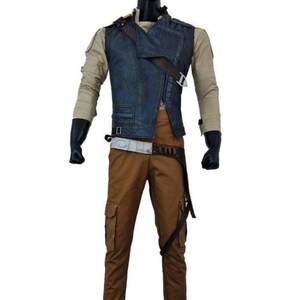 May include: A costume set comprising a blue denim vest, tan long-sleeved shirt, and brown cargo trousers. The vest has an asymmetrical design with a brown strap. The trousers have multiple pockets and a belt. Black gloves complete the outfit.
