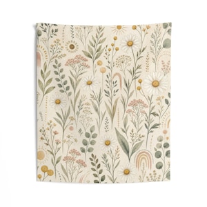May include: A rectangular wall tapestry featuring a repeating pattern of watercolor-style wildflowers, daisies, and foliage in muted tones of sage green, soft yellow, and dusty pink against a light cream-colored background with sun motifs.