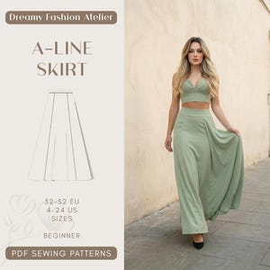 May include: A-line skirt pattern with the text "Dreamy Fashion Atelier" and "A-LINE SKIRT". The image shows a woman wearing a sage green two-piece outfit. The pattern includes sizes 4-24 US and 32-52 EU. The pattern is for beginners.