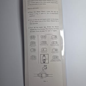May include: Instruction sheet for a Water Watch, featuring text on how to add water to the watch. The sheet includes diagrams and instructions for use. The text is in black on a white background.