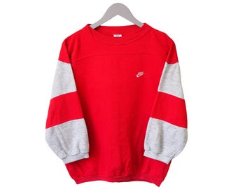 Vintage Nike sweatshirt met 3/4 mouwen en ronde hals, rood, damesmaat M, jaren 90, sportieve casual stijl, trui/pullover.