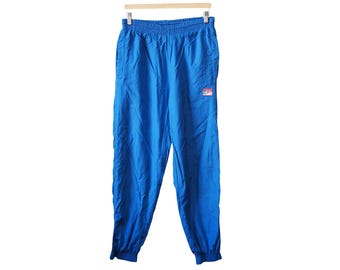 Vintage Nike Challenge Court trainingsbroek, maat M/L, jaren 90, sportieve stijl, casual, lichtgewicht, sportkleding.