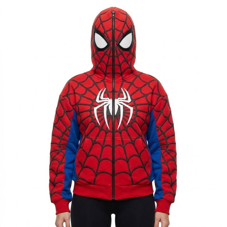 May include: Red Spider-Man zip-up hoodie with a hood that covers the head and face. The hoodie features a black spiderweb design, blue accents, and a white spider emblem on the chest. The zipper runs down the front.