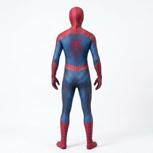 May include: A full-body costume in blue, red, and black, featuring a red spider emblem on the back. The costume has a hood and covers the entire body, including the hands and feet. The design is reminiscent of a superhero costume.
