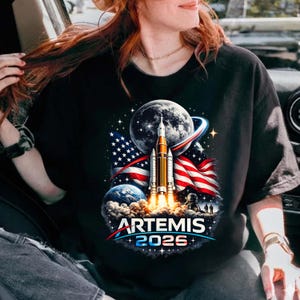 May include: A set of three ceramic mugs with a speckled, matte finish. The mugs are in shades of cream, light gray, and dark gray. Each mug has a simple, minimalist design, perfect for coffee or tea.