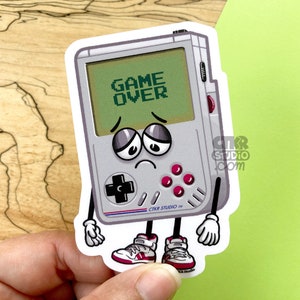 VS138 Retro Sad Video Game Console Vinyl Sticker / Game Over Pixel Art / 90s Kid Gamer / 8-bit Handheld / Funny Twitch Streamer Gift