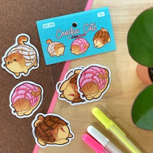 May include: A set of three Concha Cats stickers featuring cute cartoon cats shaped like Mexican sweet bread. The stickers are on a blue background with the text "Concha Cats" and "$5.00".