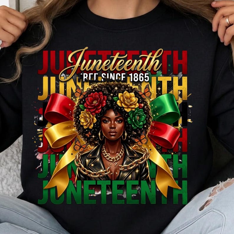 May include: Black sweatshirt featuring a graphic of a Black woman with floral hair, gold jewelry, and a leather jacket. The word "Juneteenth" is displayed in multiple colors, with "EST. SINCE 1865" above the woman.