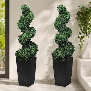May include: Two artificial topiary plants shaped into a spiral design with dense green foliage. Each plant is housed in a tall, tapered, matte black square planter. The plants feature a consistent, repeating twist pattern from base to top.
