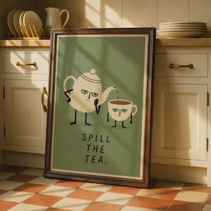 Puede incluir: Un cuadro enmarcado con fondo verde salvia que muestra una ilustración de dibujos animados de una tetera color crema vertiendo líquido en una taza a juego. Ambos tienen brazos, piernas y expresiones faciales gruñonas. El texto dice SPILL THE TEA.