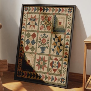 May include: A framed rectangular wall art piece featuring a multi-block quilt pattern. The design includes various geometric shapes, star motifs, and floral arrangements in muted red, blue, green, and cream tones, enclosed by a dark border.