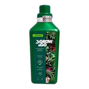 May include: A white ceramic mug with a black handle and the text "But First, Coffee" in a black, bold font. The mug is on a white surface.