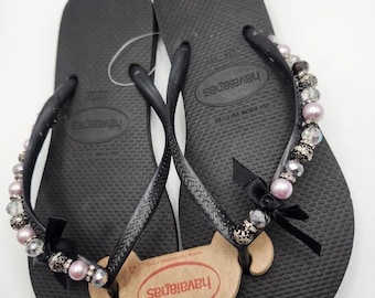 Havaianas Slim svarta flip-flops med svarta rosetter storlek 9/10