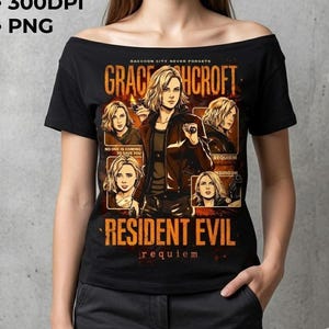 May include: Black off-the-shoulder t-shirt featuring a graphic of a woman with blonde hair, holding a gun, and the text "GRACE HCROFT" and "RESIDENT EVIL REQUIEM". The shirt also has the text "RACCOON CITY NEVER FORGETS" and "NO ONE IS COMING TO SAVE YOU".