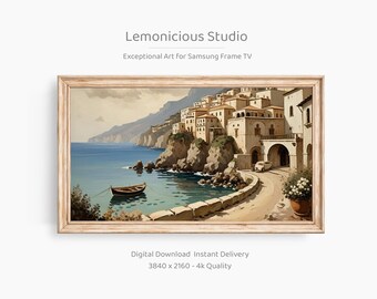 May include: A framed digital art print showing a coastal Italian town with buildings, a road, and a boat on the water. The artwork is in a vintage style, with a light wood frame. The text "Lemonicious Studio" and "Exceptional Art For Samsung Frame TV" are visible.