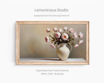 May include: A digital art print in a wooden frame, depicting a vase of pink peonies. The vase is cream-coloured, and the background is neutral. The print is labelled "Lemonicious Studio" and is "Exceptional Art For Samsung Frame TV".