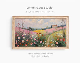 May include: A framed landscape painting with a light wood frame. The artwork shows a vibrant field of wildflowers in pinks, yellows, and whites, with a path leading to a house under a cloudy sky. The text "Lemonicious Studio" is at the top.
