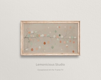 May include: A framed print with a beige backdrop, displaying a branch design with colourful, egg-shaped elements. The eggs are in orange, green, and white. The text "Lemonicious Studio" and "Exceptional Art for Frame TV" are visible on the print.