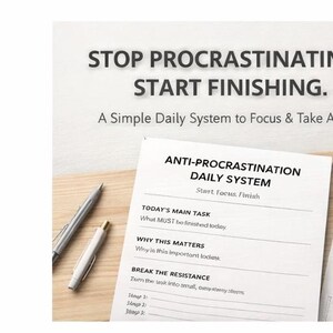 May include: A productivity-themed image with the text "STOP PROCRASTINATING. START FINISHING." and "ANTI-PROCRASTINATION DAILY SYSTEM." The image includes pens, paper, and a paperclip on a wooden surface. The system is designed to help focus and take action.