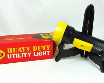 Lampe utilitaire robuste Kewaunee de collection, d'épargne et de prêt par Ray-O-Vac (vers les années 1970)