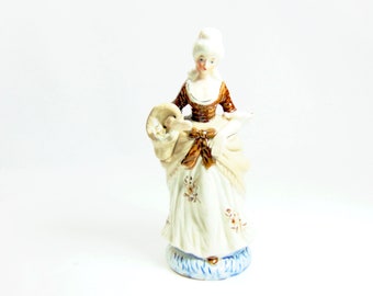 Collectible Colonial Woman Collecting Flowers Figurine ( Ca. 1960's)
