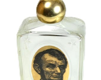 Frasco vintage Avon Abraham Lincoln, decantador de loção pós-barba Wild Country com tampa em forma de águia, item colecionável americano para exibição.