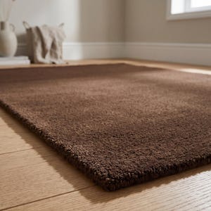 Detailed low-angle view showing the plush tufting, making it a mature, architectural alternative to busy traditional navajo rugs.