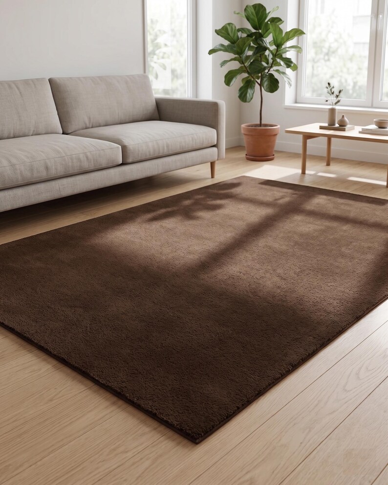 Close-up on the natural dyes capturing the deep, rich brown tones under natural light, showcasing why this solid foundation is a favorite among collections of fun rugs.