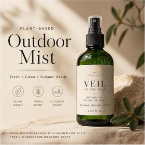 May include: A green glass bottle of "Veil of the Wild" botanical outdoor mist. The label reads "plant-based, lightweight, refreshing" and "8 oz / 237 mL". The text "Outdoor Mist" is at the top, with "Fresh, Clean, Summer Ready" below it.