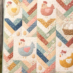 May include: A patchwork quilt with a farm theme. The quilt features appliqued chickens in various colors, eggs, and a basket of eggs. The background is a mix of patterned fabrics in pastel colors, arranged in a chevron pattern.