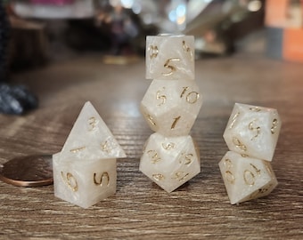 Ivory: A MINIATURE set of handmade resin polyhedral sharp edge dice for use in DnD and ttrpgs.