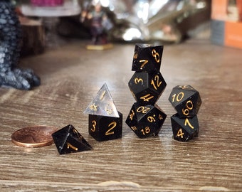 Obsidian: A MINIATURE set of handmade resin polyhedral sharp edge dice for use in DnD and ttrpgs.