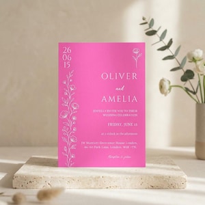 Könnte beinhalten: Eine leuchtend pinke, rechteckige Hochzeitseinladungskarte mit weißem Text und einer zarten floralen Strichzeichnung. Der Text lautet Oliver and Amelia, joyfully invite you to their wedding celebration, Friday, June 15, at 3 o'clock in the afternoon.