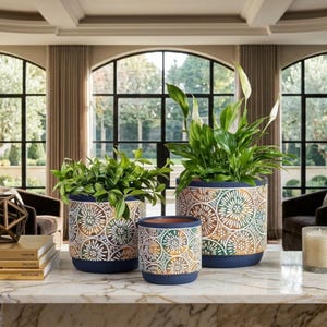 May include: A set of three ceramic mugs with a speckled, matte finish. The mugs are in shades of cream, light gray, and dark gray. Each mug has a simple, minimalist design, perfect for coffee or tea.