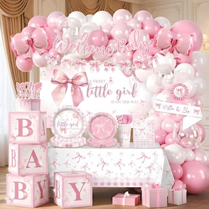 May include: A baby shower party set featuring pink and white balloons, a backdrop with the text Welcome Baby and A sweet little girl is on her way, four large lettered blocks spelling BABY, plates, napkins, cups, and gift boxes with bow designs.