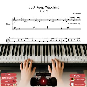 May include: A digital piano score titled Just Keep Watching from F1 by Tate McRae, featuring black musical notation on a white background above a black and white piano keyboard. The sheet music includes lyrics and a small graphic of a race car.