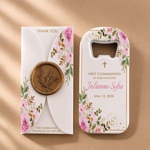 May include: A white bottle opener and a matching card with floral designs and the text "THANK YOU". The bottle opener has the text "FIRST COMMUNION OF OUR DAUGHTER Julianna Sofia May 12, 2030".