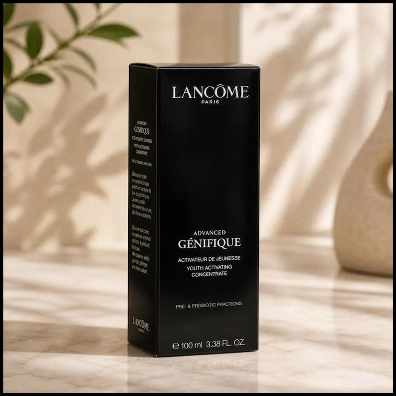 May include: A black rectangular box of Lanc&ocirc;me Advanced G&eacute;nifique Youth Activating Concentrate. The box has white text that reads "Lanc&ocirc;me Paris" and "Advanced G&eacute;nifique". The box contains 100 ml of product.