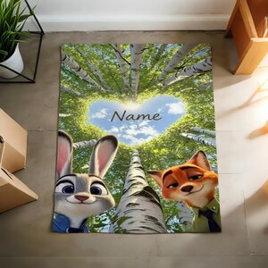 May include: A rectangular rug featuring the characters Judy Hopps and Nick Wilde from Zootopia. The rug has a backdrop of birch trees forming a heart shape with the word "Name" in the centre. The characters are in the foreground.