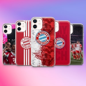 May include: A selection of iPhone cases showcasing the FC Bayern Munich logo and team imagery. The cases feature the team's logo, red and white colours, and player photos. The cases are designed for a modern smartphone.