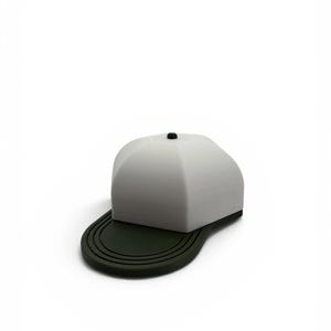 May include: A structured baseball cap featuring a smooth, light gray crown with a small black button at the top center. The brim is dark green and displays a series of concentric, raised circular lines that follow the curved edge of the visor.