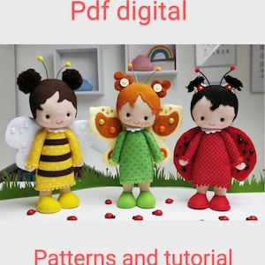 May include: Three felt dolls dressed as a bee, butterfly, and ladybug. The dolls have brown, red, and blonde hair and are wearing colorful outfits. The dolls are standing on a green surface with red ladybug decorations. The text "Pdf digital" and "Patterns and tutorial" are at the top and bottom of the image.