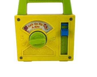 Vintage Fisher-Price Wind-up Radio Yellow 1978 Musical "Let's Go Fly a Kite"